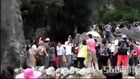 Tourists brawl over best position in front of rock to take pictures