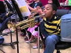 Armless Child Plays Trumpet